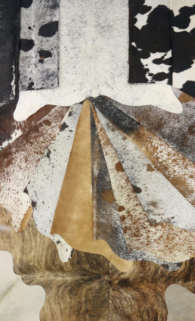Different designs of Hanlin cowhides folded against each other.